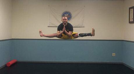 Image of Herman Abuchowski practicing martial arts jump