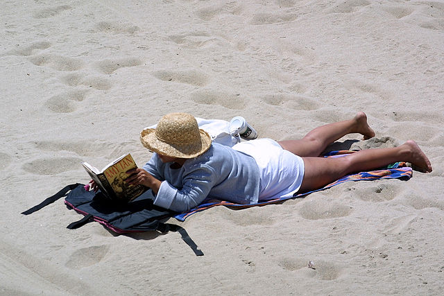 Woman reading on beach