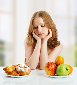 student weighing food choices