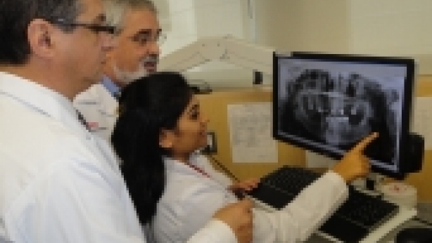 Benoliel (left) and Heir listen to student description of imaging.