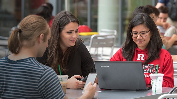 Rutgers Today, Rutgers news - Rutgers Selects Canvas as Official Learning Management System, Rutgers students use a laptop outdoors
