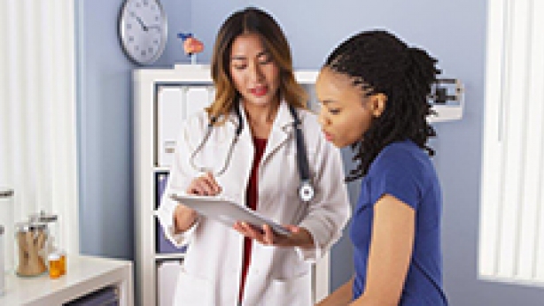 Image of physician with adolescent girl