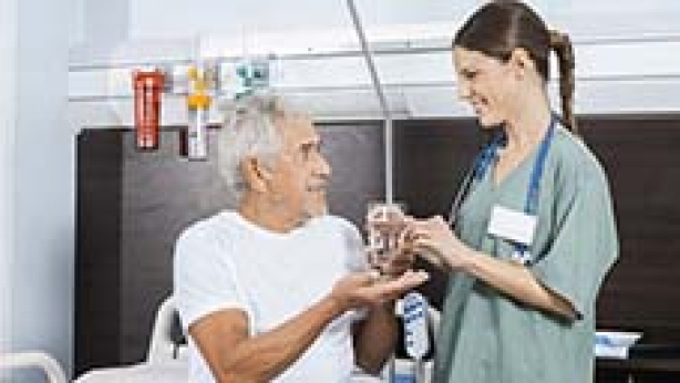 Image of nurse offering care to patient