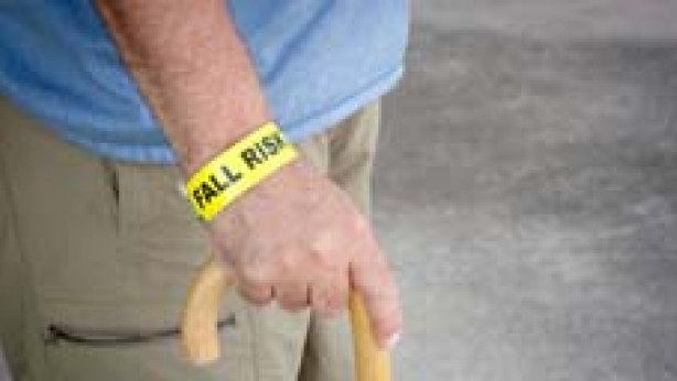 Image of male senior citizen using a walker.