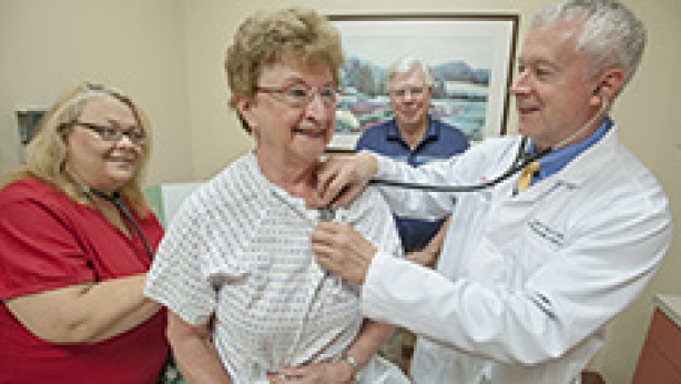 Dr. Alfred Tallia examines Barbara Carcich